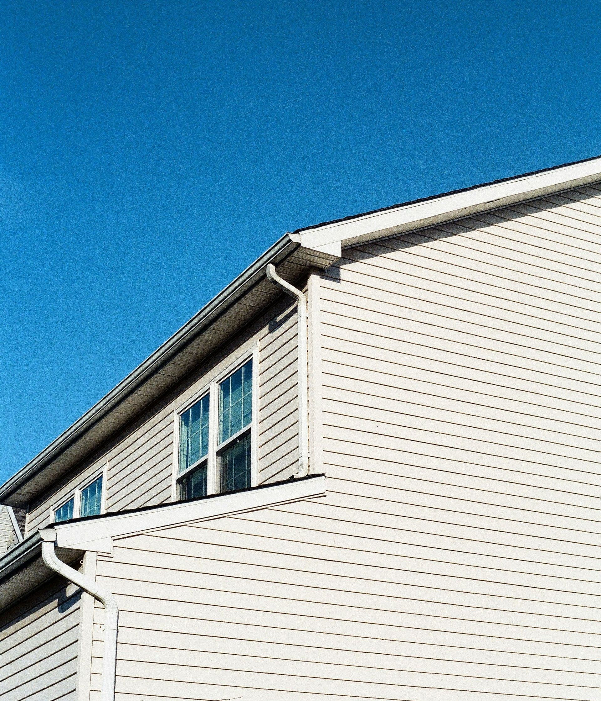 white wooden house under blue sky during daytime